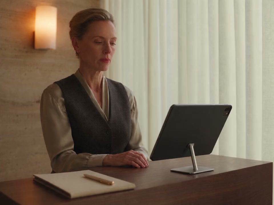 A practitioner independently reviews the patient record on an iPad