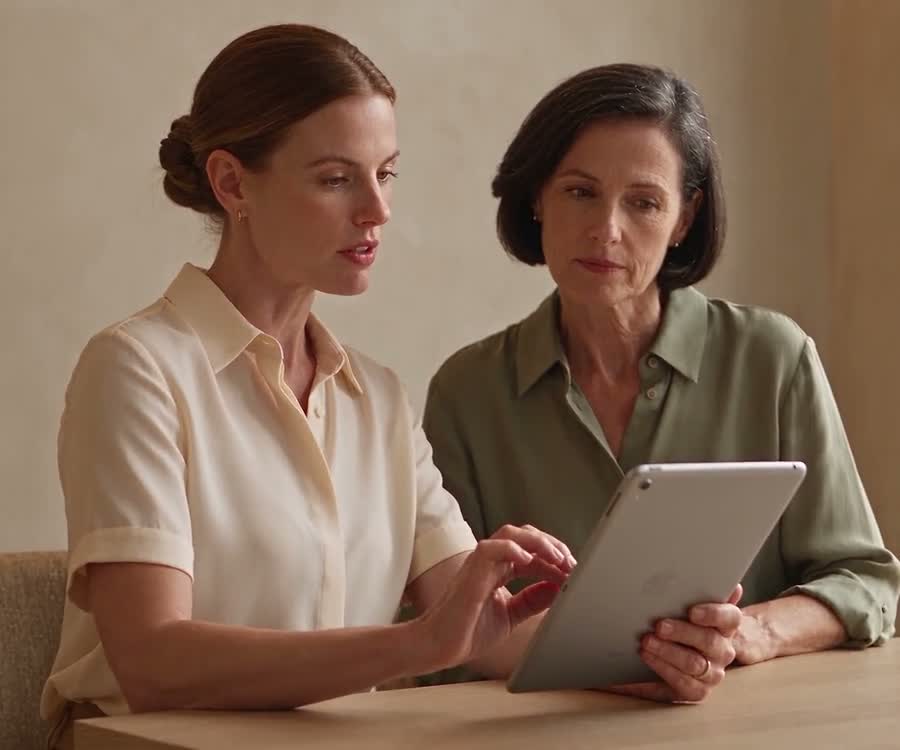 Illustrative footage of a practitioner and patient looking at an iPad together in a consultation.